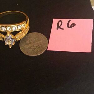 NEW ladies size 10 ring in gold tone with white/clear stones costume ring